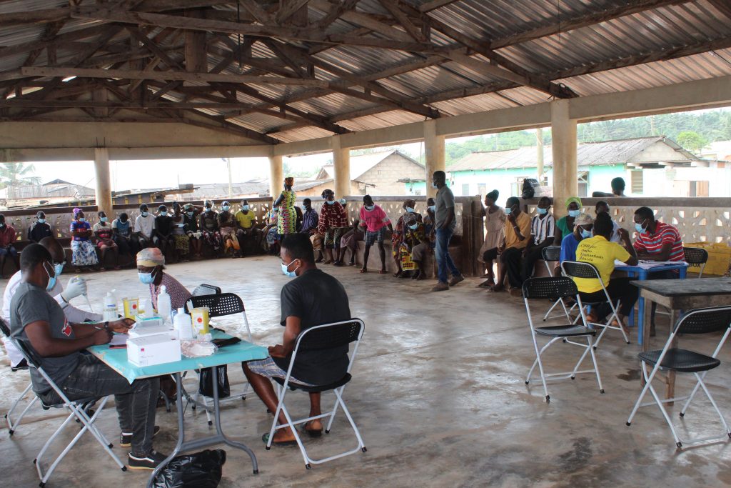 Community members in a queue to be fingerpricked for circulating filarial antigen (CFA) using the filarial test strip (FTS) 